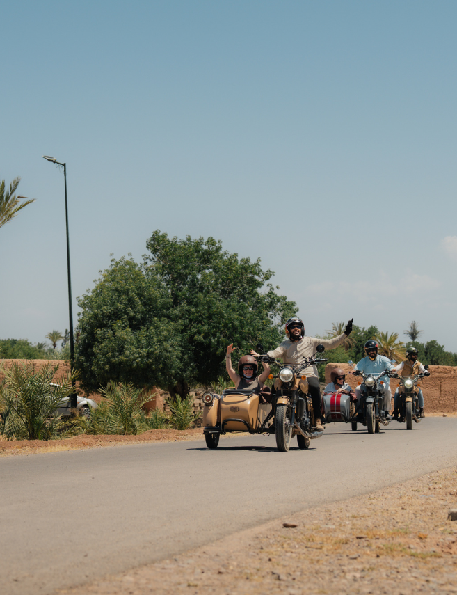 event attendees riding in side cars
