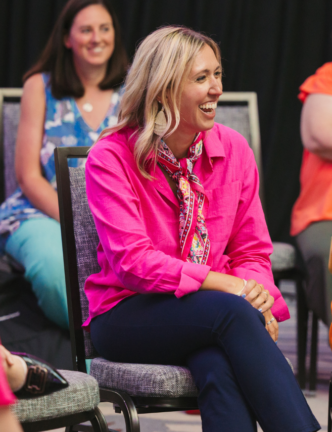 woman sitting in circle of breakout session at sales meeting event